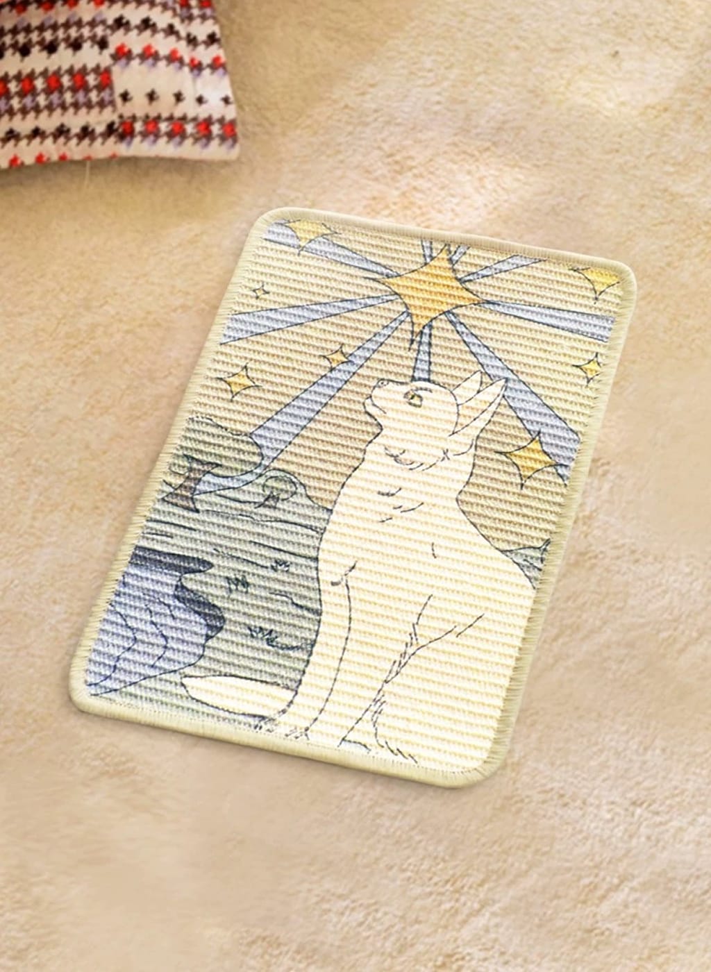 Decorative rug with a cat design on a beige carpet